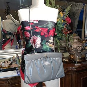 Sakowitz gray leather clutch